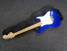 A Fender Squier stratocaster electric guitar in carry bag