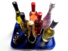 A tray containing eight assorted bottles of alcohol to include Rose wine, Cava Brut,