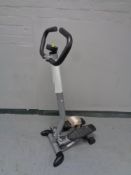 A Corby trouser press together with a Crane Sports fitness stepper