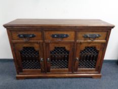A William Sheppee Indian Collection Tansen triple door sideboard