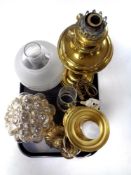 A tray containing two brass oil lamps with chimneys, one with shade, converted,