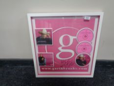 A Garth Brooks Ultimate Hits montage, signed, framed, 50 cm x 53 cm.