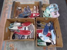 Four boxes containing a quantity of Zipz interchangeable shoes