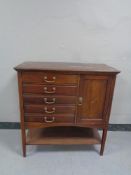 An Edwardian five drawer music chest with brass drop handles