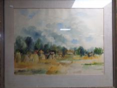 A 20th century watercolour, Field with village beyond, signed Phillips.