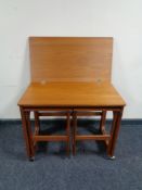 A 20th century teak G Plan turn over top trolley fitted two tables beneath