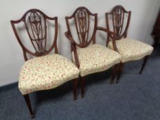 A set of eight reproduction mahogany Hepplewhite dining chairs comprising of two carvers and six