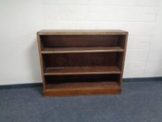 A set of early 20th century oak open bookshelves