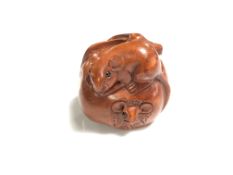 A carved Chinese hardwood netsuke - Two rats in a fruit
