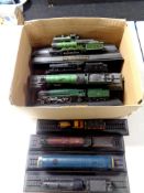 A box containing 15 die cast model trains on stands to include Flying Scotsman, A4 Mallard,
