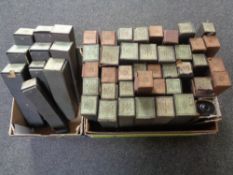 Two boxes containing a quantity of pianola rolls