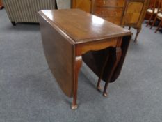 An Edwardian gate leg table