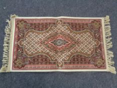 A Persian silk finished fringed prayer rug