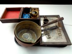 A tray containing two antique copper and brass pans, Guinness advertising mirror,