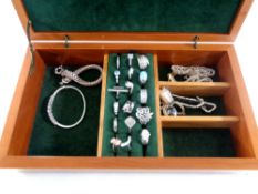 A jewellery box containing a collection of silver jewellery to include rings, bracelets,