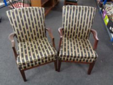 A pair of Parker Knoll armchairs upholstered in a striped fabric
