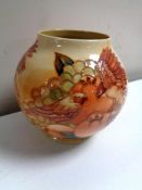 A Walter Moorcroft vase decorated with finches and fruit, height 16.