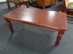 A contemporary coffee table in an antique finish