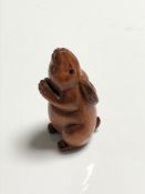 A carved Chinese hardwood netsuke - Rabbit