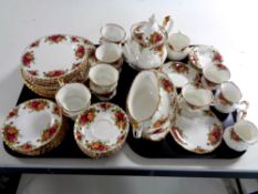 Two trays containing 57 pieces of Royal Albert Old Country Roses tea and dinner china