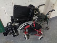 A folding wheelchair together with two mobility walking aids