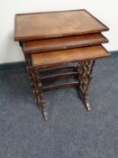 A nest of three mahogany Regency style tables