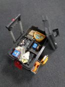 A plastic tool chest on wheels containing assorted tools together with a motoring lamp and a camp