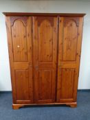 A Ducal pine triple door wardrobe