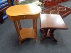 A kidney shaped two tier occasional table fitted a drawer together with a further pedestal