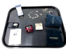 A tray of costume jewellery, silver dress ring, silver cat pendant on chain, another silver pendant,