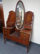 A late Victorian inlaid mahogany sunk centre dressing table with mirror back