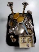 A pair of plated candlesticks, plated pieces inc.