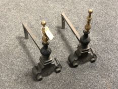 A pair of Victorian cast iron and brass fire dogs