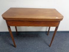 A 19th century inlaid mahogany turnover top tea table