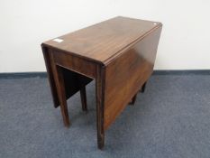A 19th century mahogany drop leaf table