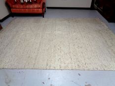 A contemporary woolen fringed woolen carpet