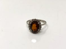 An 18ct white gold garnet dress ring, size P.
