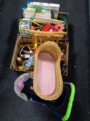 Two boxes containing a quantity of children's puzzles, toys, dolls, Russian doll,
