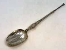 A large silver gilt copy of an anointing spoon by Elkington,