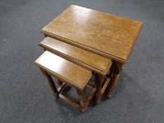 A nest of three oak tables