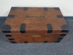 A wooden metal bound storage chest marked 