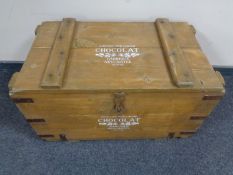 A wooden metal bound storage box marked Chocolat Fabrique Neuchatel Suisse