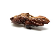 A carved Chinese hardwood netsuke - Rat pulling a turtle