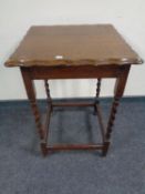 An Edwardian oak barley twist occasional table