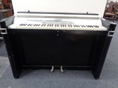 An Eavestaff Pianette mini piano