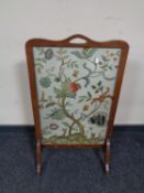 Two embroidered mahogany fire screens