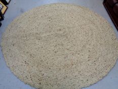 A contemporary circular woolen rug