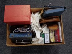 A box of miscellany to include oriental plate and ornament, cased cutlery, travel set, books,