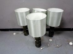 Four contemporary ribbed glass table lamps with shades