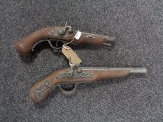 A pair of replica flintlock pistols